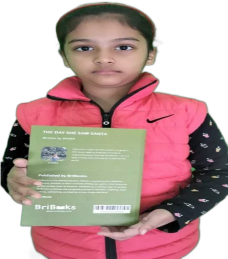 Maria holding her published book, The Day She Saw Santa