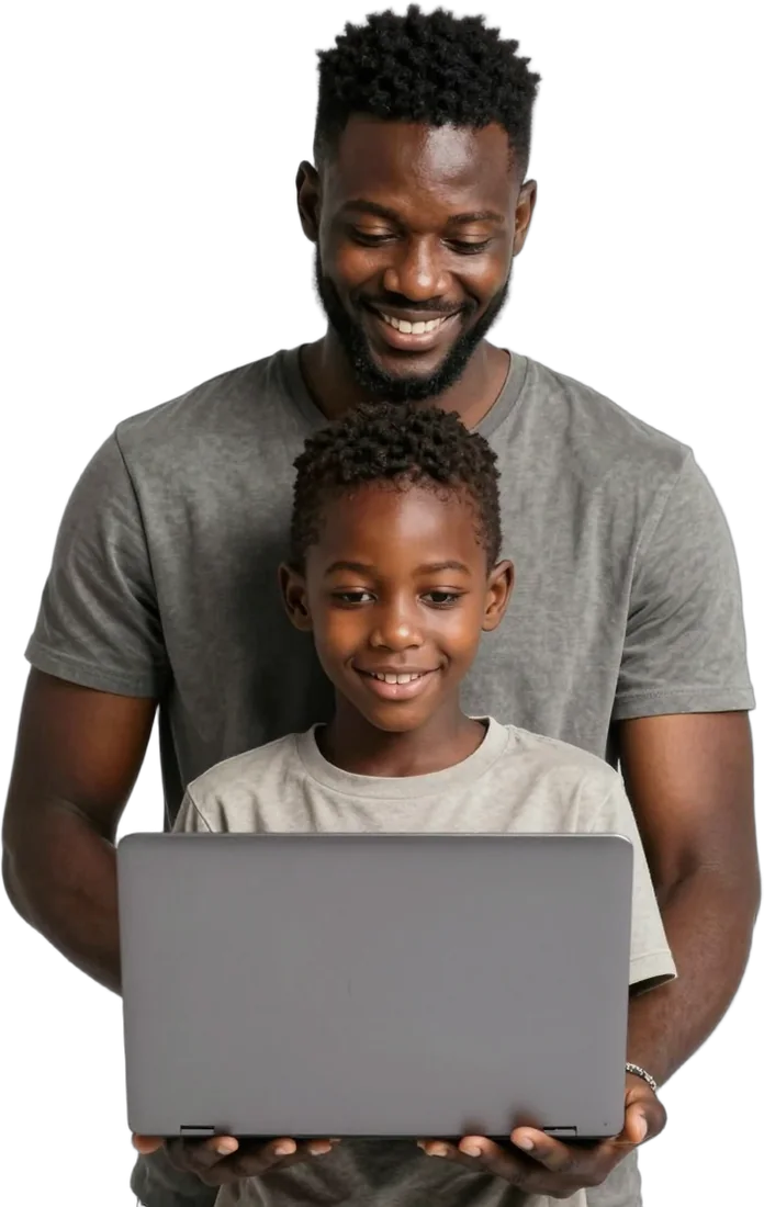 A parent and son smiling at a laptop together