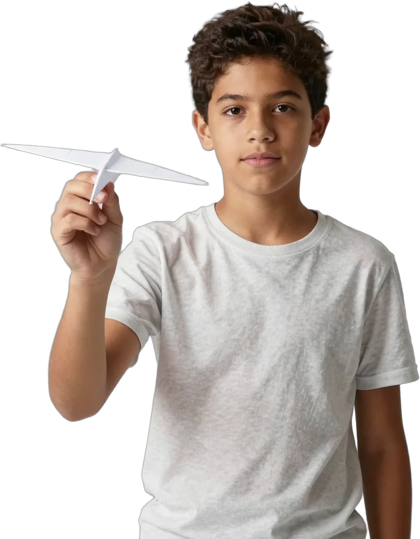 A boy holding a paper glider