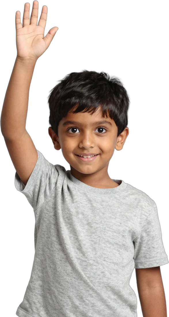 A boy raising his hand eagerly with a pencil in his other hand