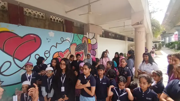 The Bengaluru Art Fest group in front of the heart mural