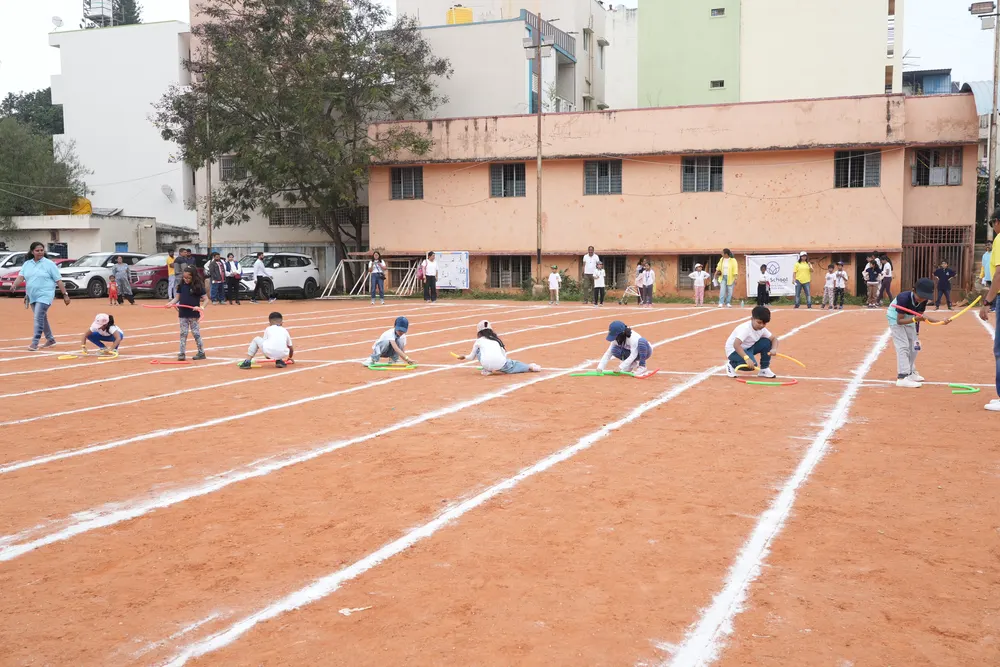 Young learners crouched at their starting marks across the track, ready for the next race