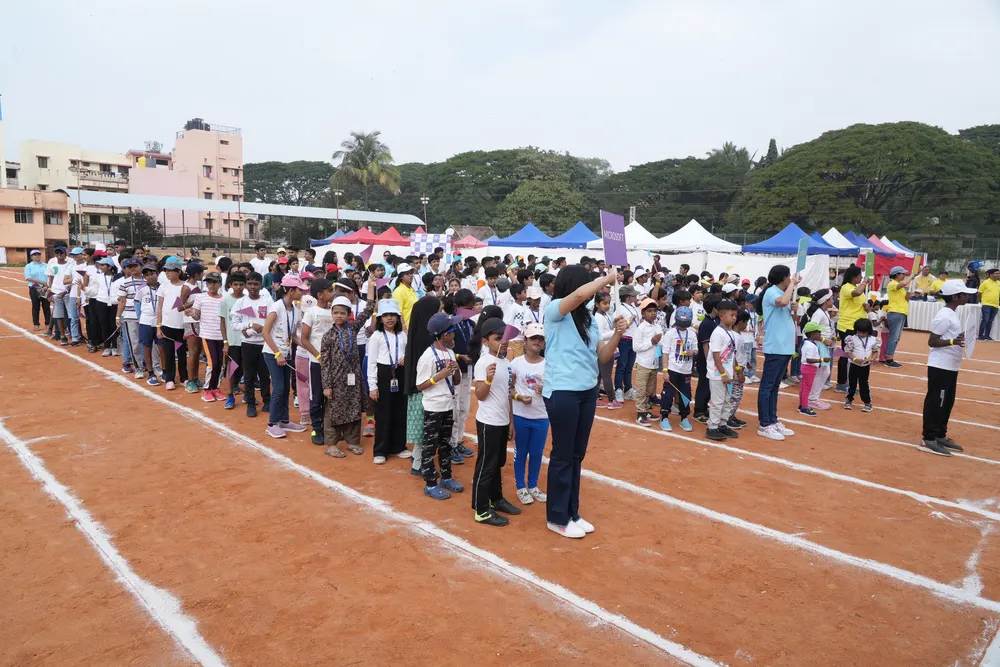 Learners lined up side by side across the track at a 21K School Sports Day
