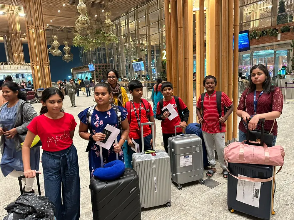 Learners with their suitcases at the airport, setting off for Dubai