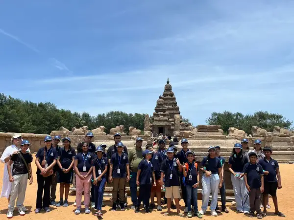 21K School learners and staff in a group photo in front of the Shore Temple at Mahabalipuram