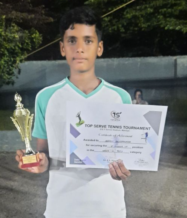 Adarsh holding his trophy and Top Serve Tennis Tournament certificate