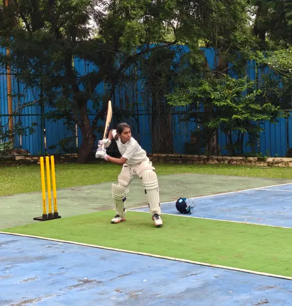 A learner batting at the cricket nets