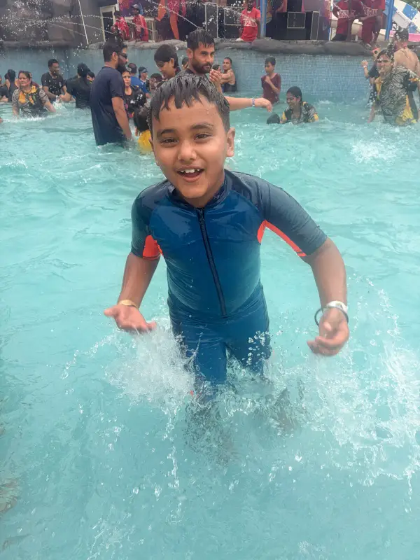 A learner splashing in a swimming pool