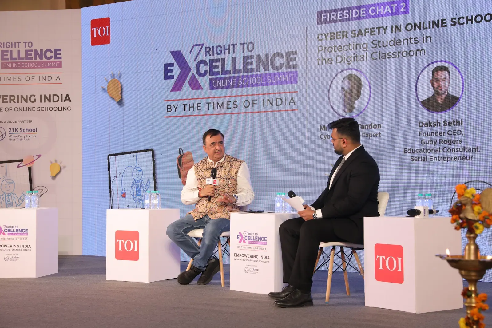 The fireside chat on cyber safety in online schools, the two speakers seated on stage