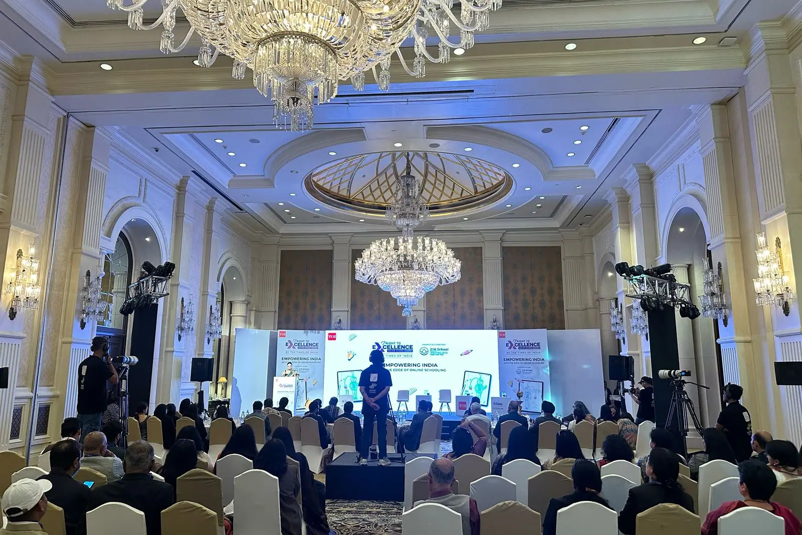 The ballroom at The Leela Palace, New Delhi, with guests seated before the Right to Excellence stage